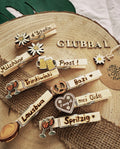 Holz Glubbal mit Symbolen und Beschriftung